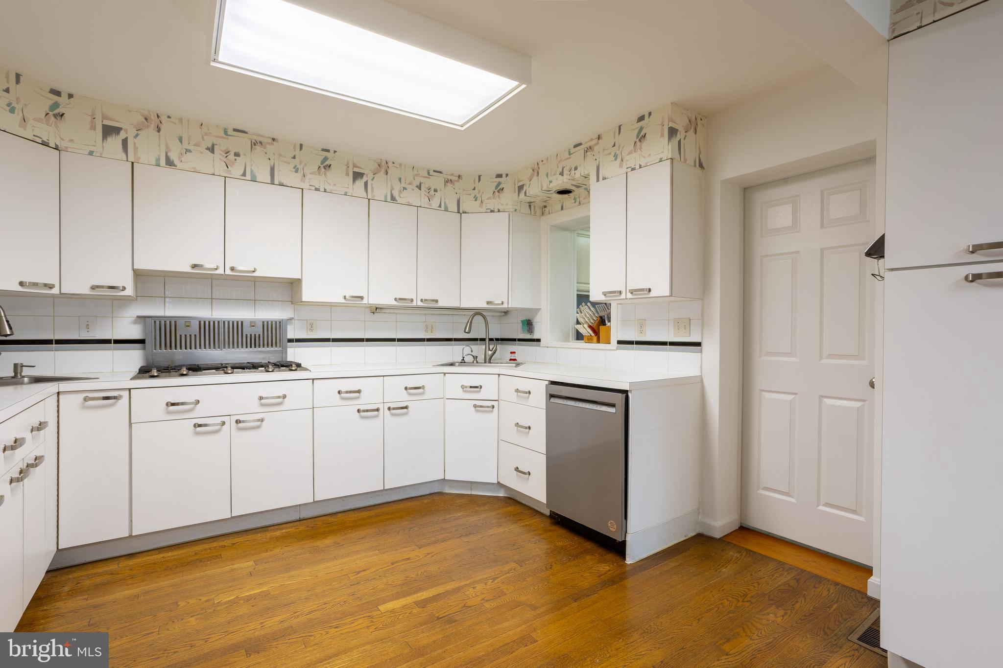 3215 Northbrook Road Baltimore, MD 21208 - Photo 11 of 48 a kitchen with granite countertop white cabinets and white appliances
