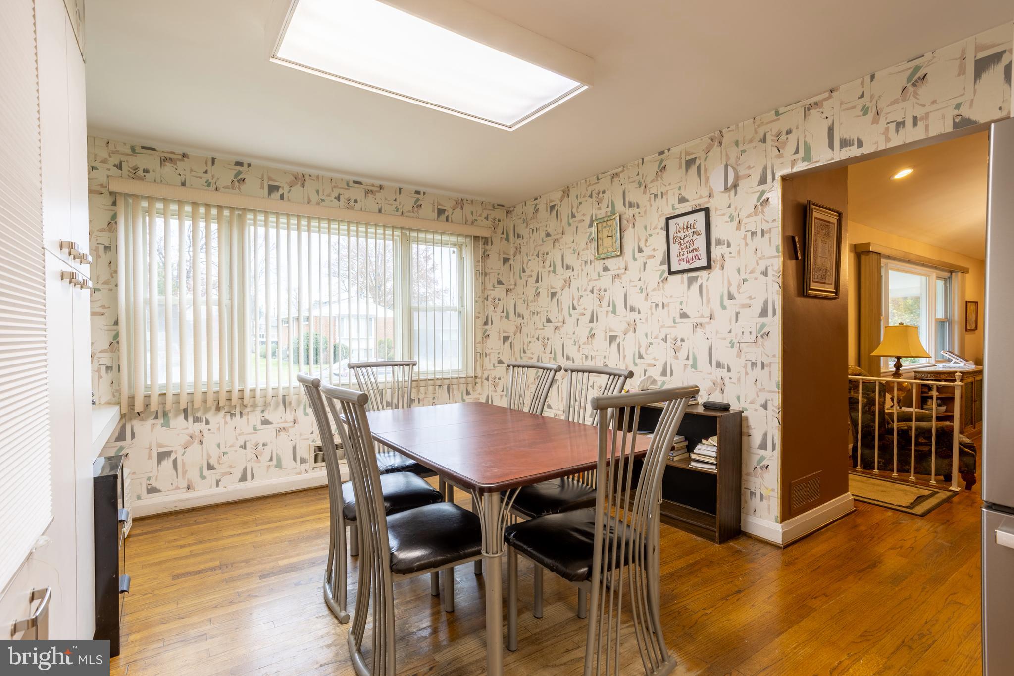 3215 Northbrook Road Baltimore, MD 21208 - Photo 14 of 48 a view of a dining room with furniture and wooden floor