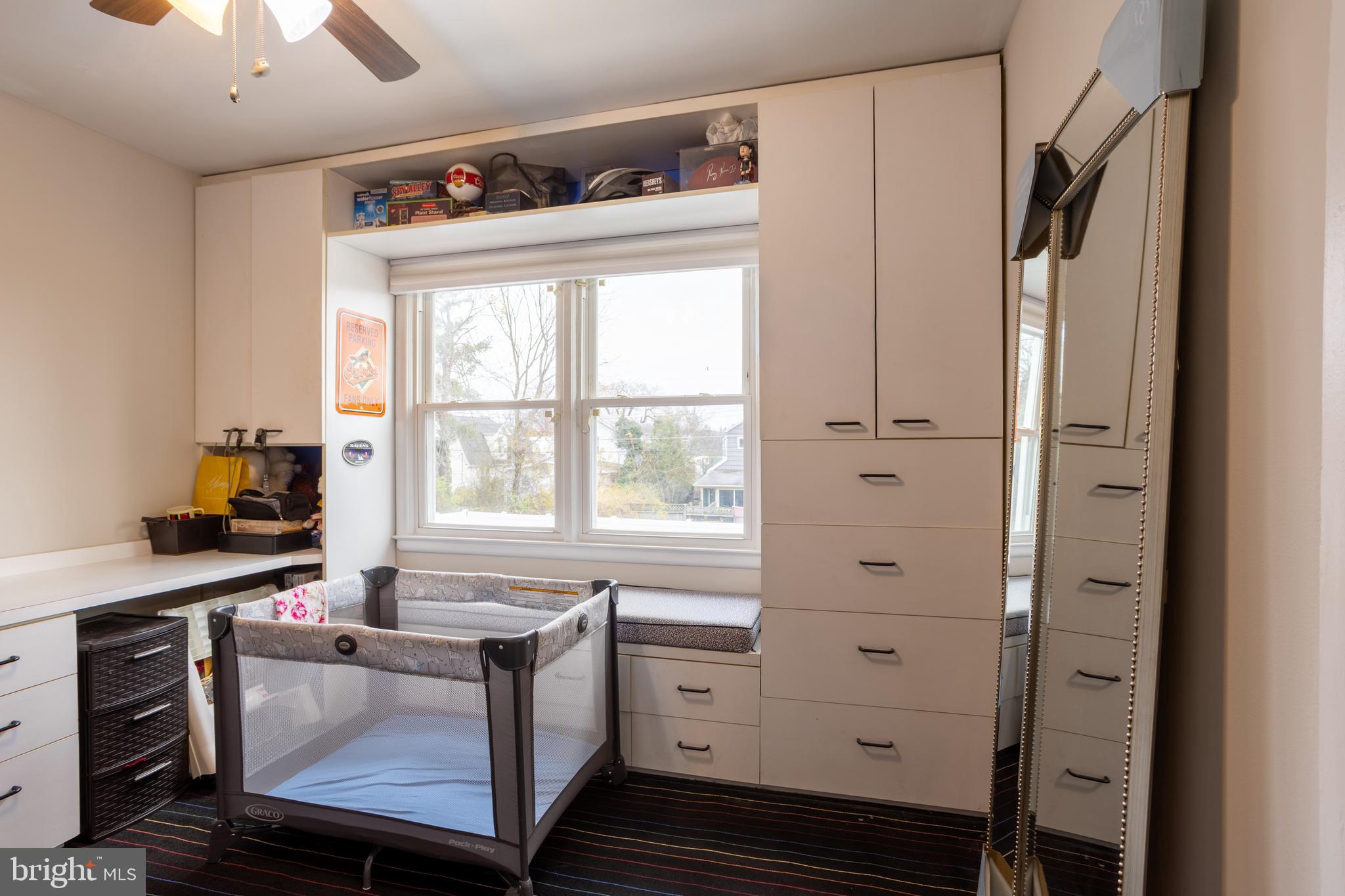 3215 Northbrook Road Baltimore, MD 21208 - Photo 25 of 48 a kitchen with cabinets appliances and a window