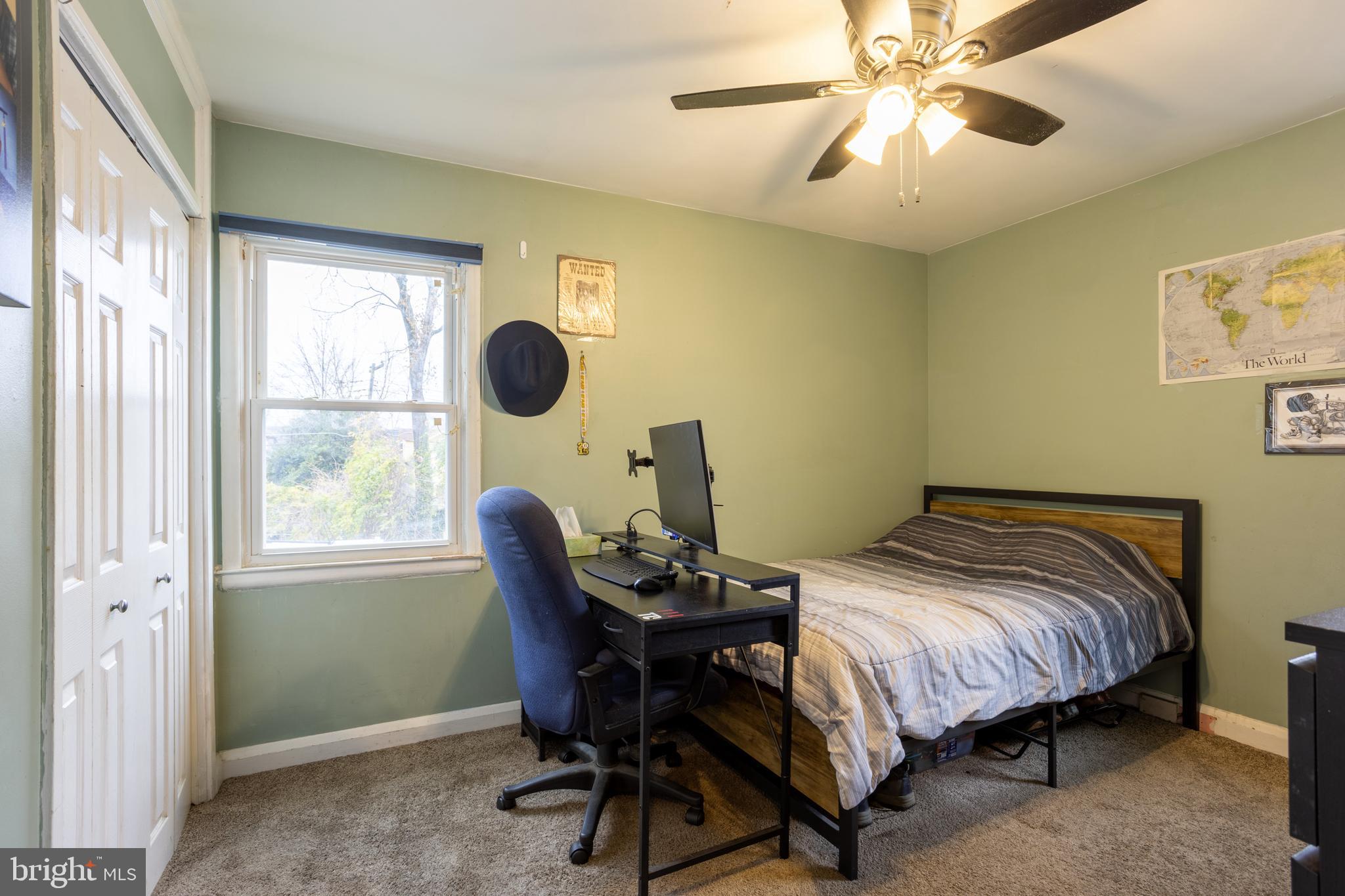 3215 Northbrook Road Baltimore, MD 21208 - Photo 27 of 48 a bedroom with a bed and a window