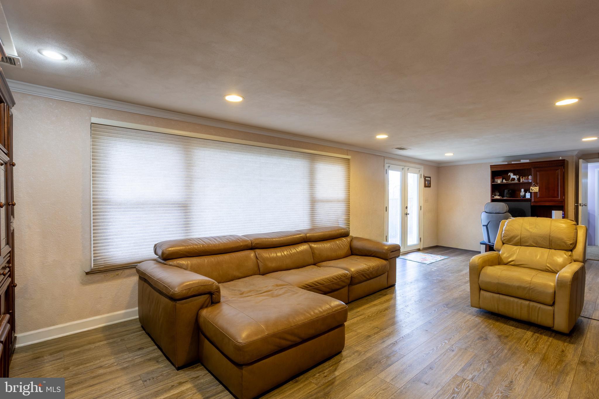 3215 Northbrook Road Baltimore, MD 21208 - Photo 32 of 48 a living room with furniture and wooden floor
