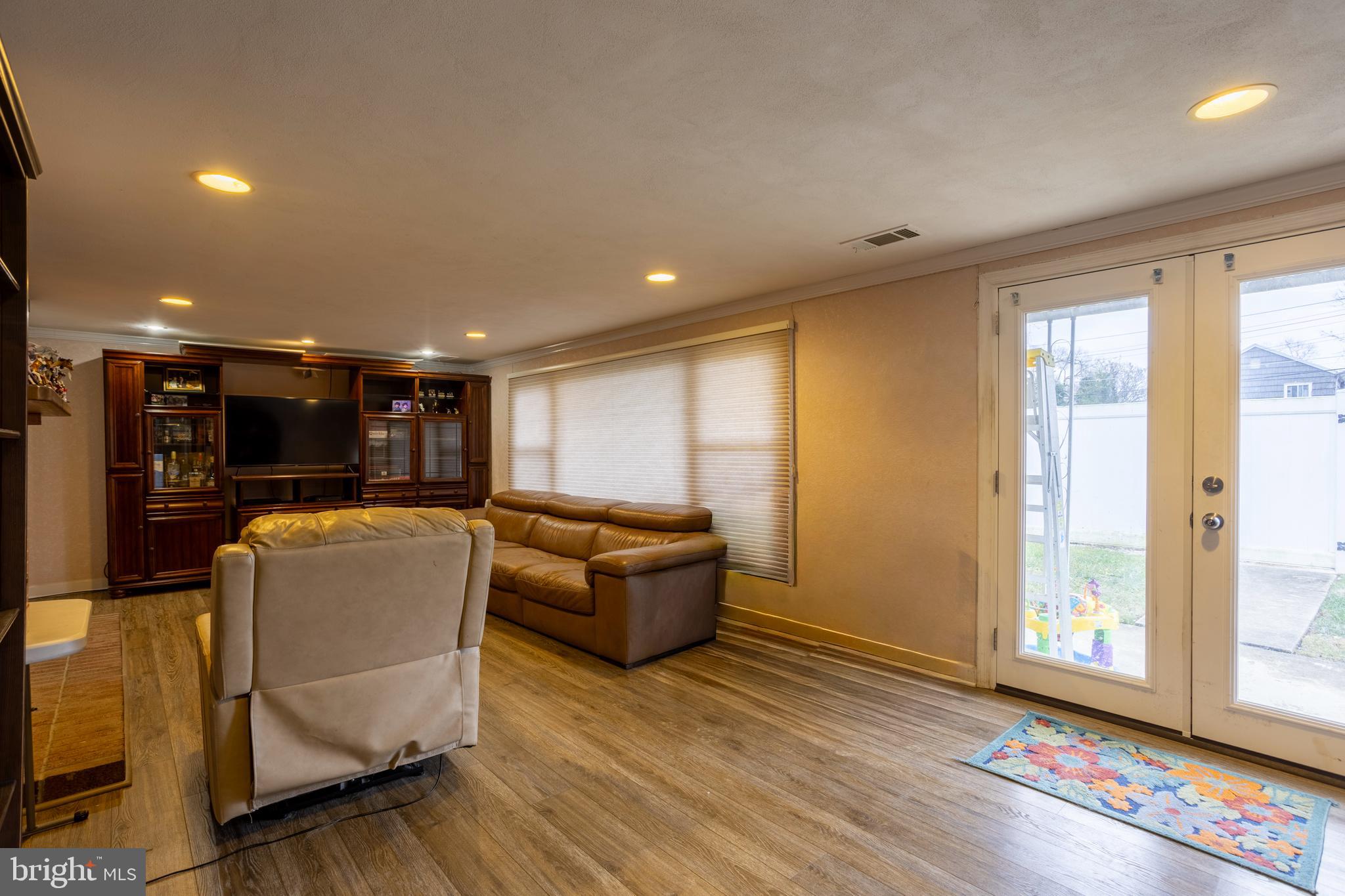 3215 Northbrook Road Baltimore, MD 21208 - Photo 33 of 48 a living room with furniture and a large window