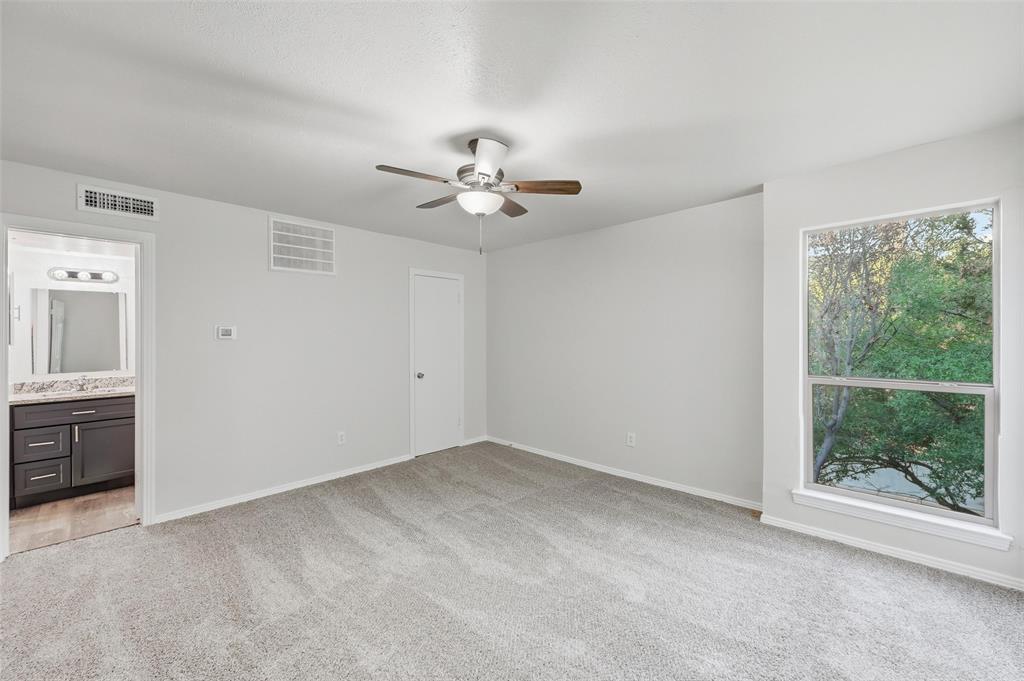 2702 Douglas Avenue, Unit 121 Dallas, TX 75219 - Photo 25 of 34 wooden floor in an empty room with a window