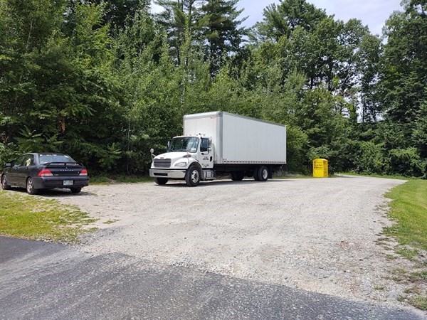 254 West River Road Hooksett, NH 03106 - Photo 2 of 5 a car parked on the side of the road