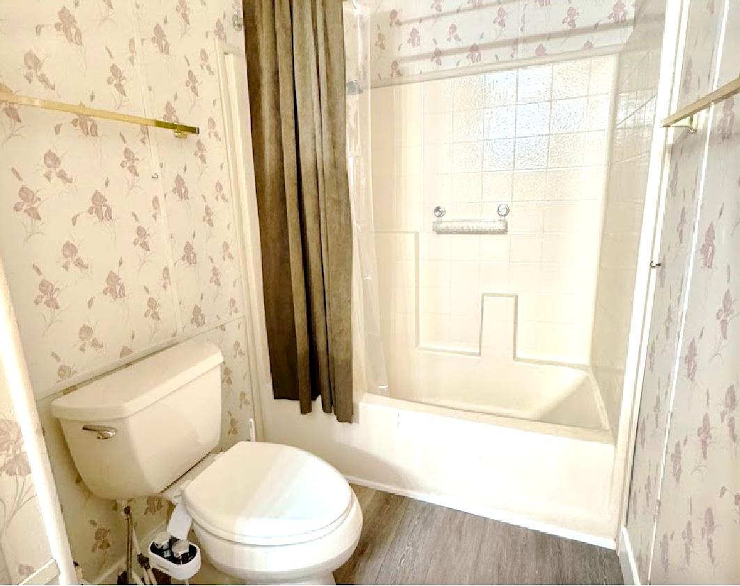 55 Pacifica Avenue, Unit 90 Bay Point, CA 94565 - Photo 12 of 12 a bathroom with a toilet and a shower