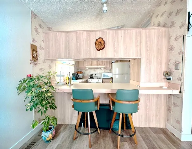 a kitchen with a table and chairs in it