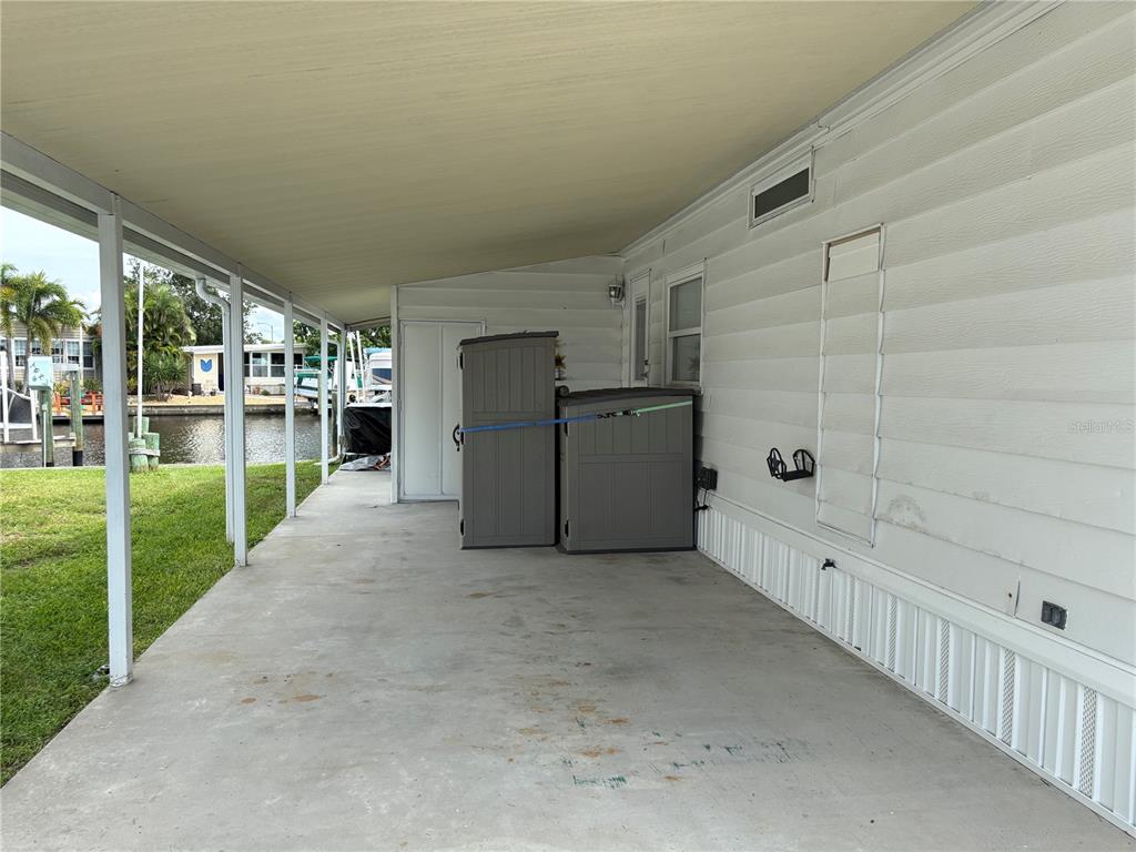 6803 Mt Pleasant Road Northeast, Unit 33 St. Petersburg, FL 33702 - Photo 21 of 28 a view of a porch