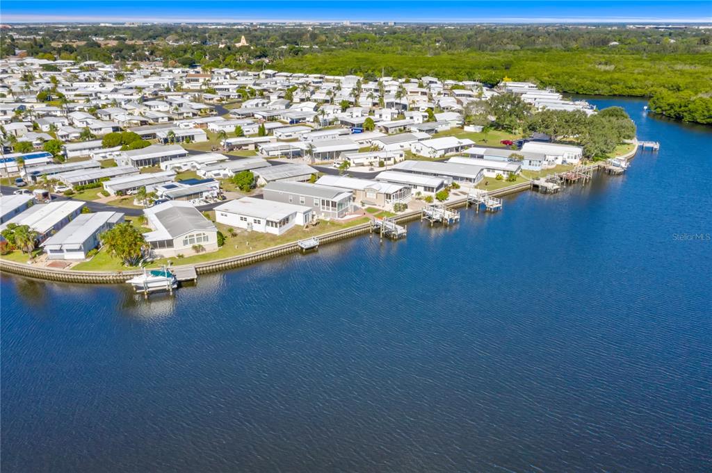 6803 Mt Pleasant Road Northeast, Unit 33 St. Petersburg, FL 33702 - Photo 25 of 28 an aerial view of a house with a ocean view