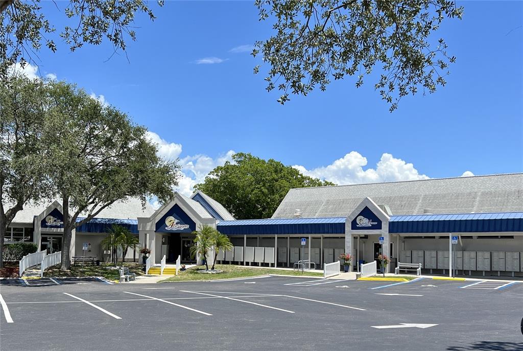 6803 Mt Pleasant Road Northeast, Unit 33 St. Petersburg, FL 33702 - Photo 27 of 28 a front view of a building with streets and trees