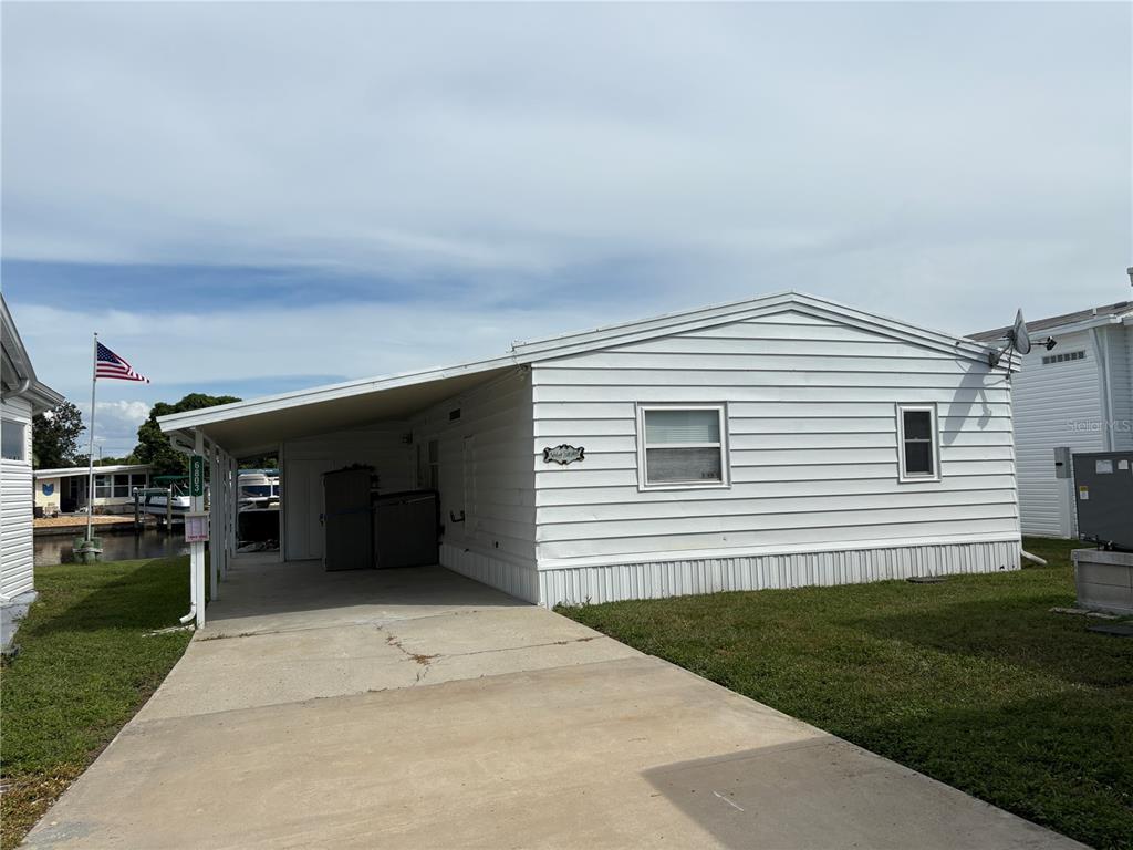 6803 Mt Pleasant Road Northeast, Unit 33 St. Petersburg, FL 33702 - Photo 3 of 28 a view of a house with a backyard