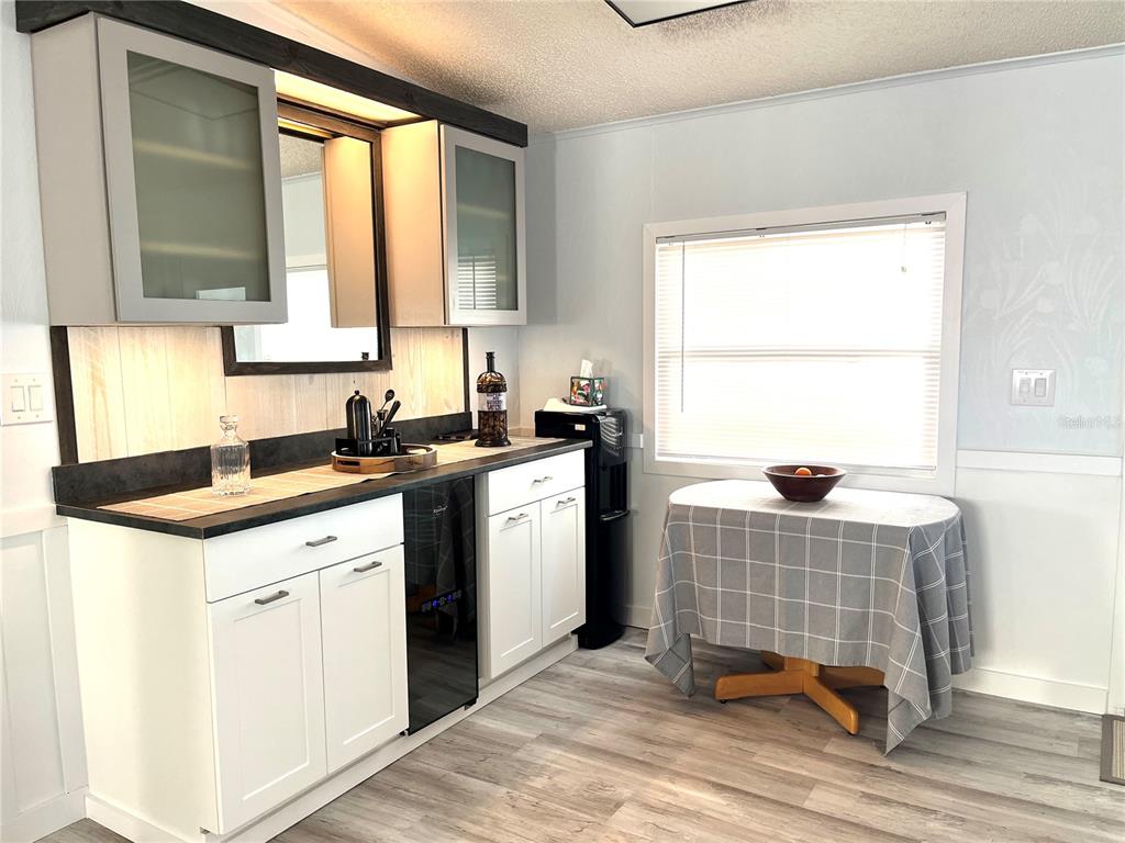 6803 Mt Pleasant Road Northeast, Unit 33 St. Petersburg, FL 33702 - Photo 10 of 28 a kitchen with a sink cabinets and window
