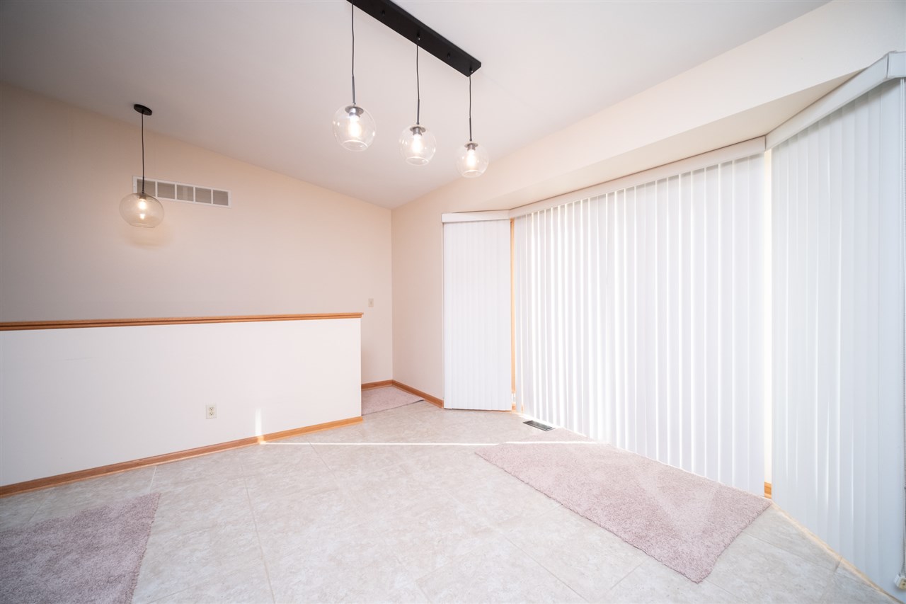 7290 Stephens Road Rockton, IL 61072 - Photo 12 of 30 an empty room with chandelier fan