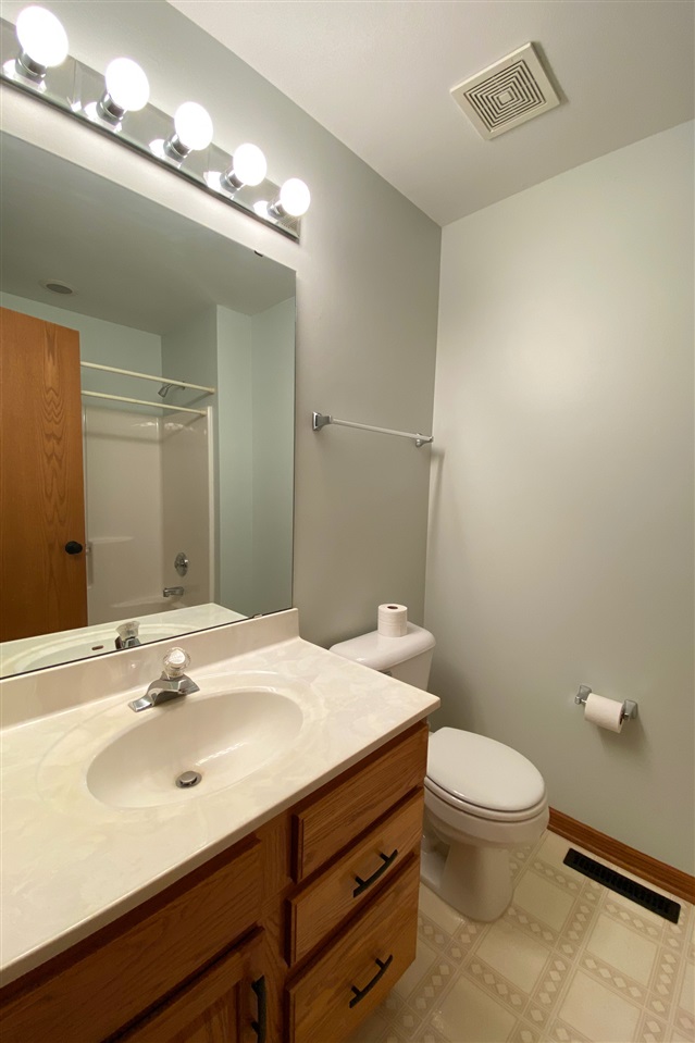 7290 Stephens Road Rockton, IL 61072 - Photo 21 of 30 a bathroom with a sink a toilet and mirror
