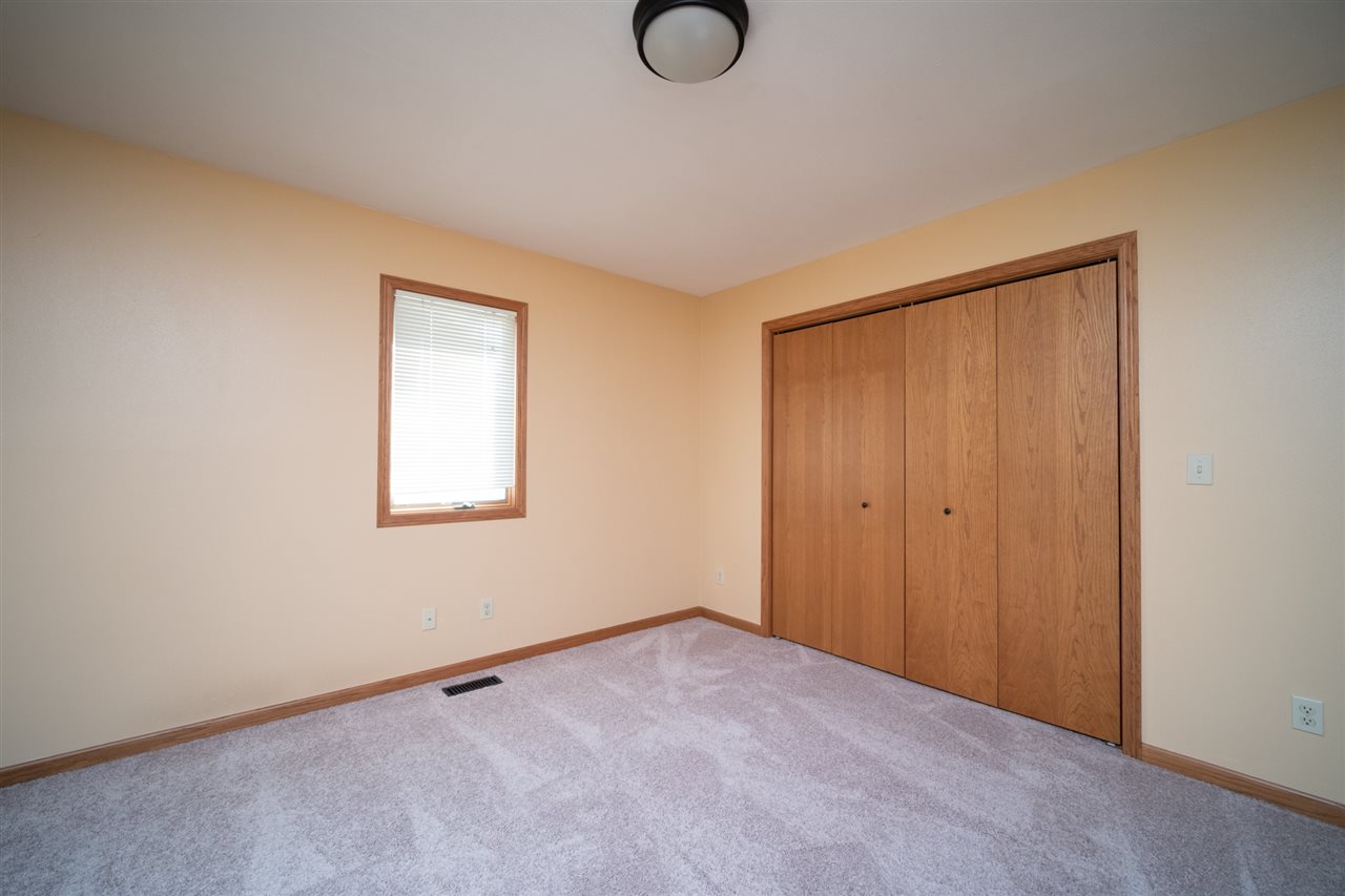 7290 Stephens Road Rockton, IL 61072 - Photo 22 of 30 a view of an empty room with chandelier fan