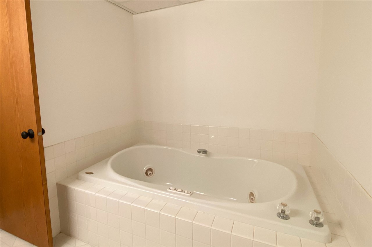 7290 Stephens Road Rockton, IL 61072 - Photo 26 of 30 a white bath tub sitting in a bathroom