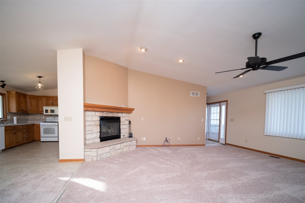 7290 Stephens Road Rockton, IL 61072 - Photo 7 of 30 a view of a livingroom with a fireplace and window
