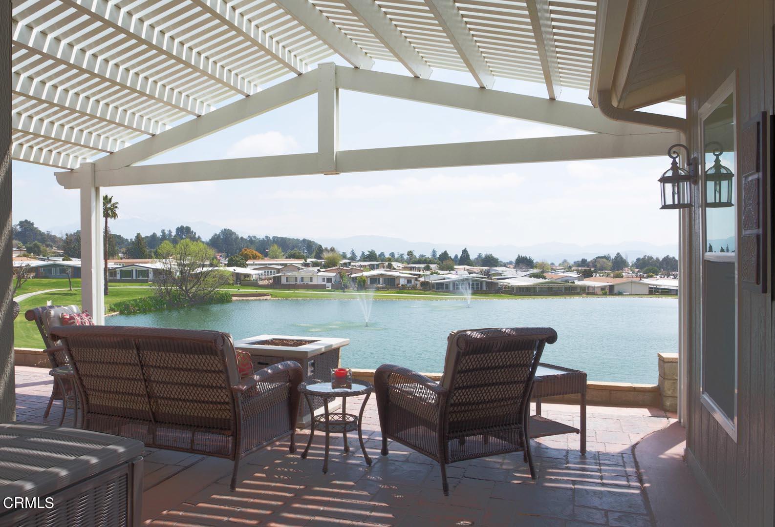40775 Cheyenne Trail Cherry Valley, CA 92223 - Photo 1 of 21 a view of a lake with couches and wooden floor