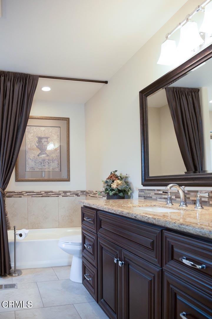40775 Cheyenne Trail Cherry Valley, CA 92223 - Photo 11 of 21 a bathroom with a tub sink and mirror