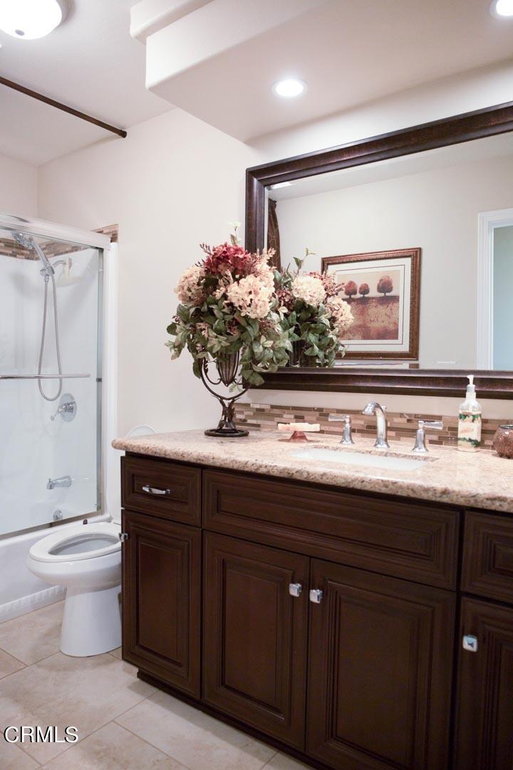 40775 Cheyenne Trail Cherry Valley, CA 92223 - Photo 13 of 21 a bathroom with a granite countertop sink mirror and toilet