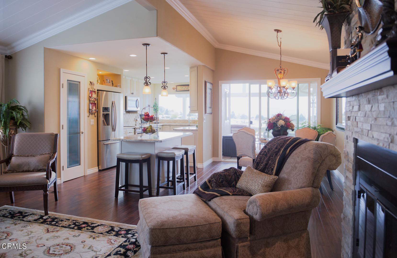 40775 Cheyenne Trail Cherry Valley, CA 92223 - Photo 9 of 21 a living room with furniture a chandelier and a dining table