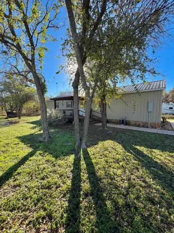 a view of backyard with outdoor space
