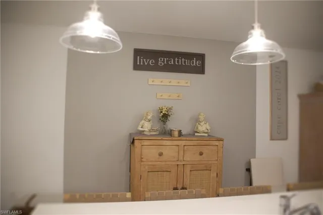 a view of a porch with furniture and a yard