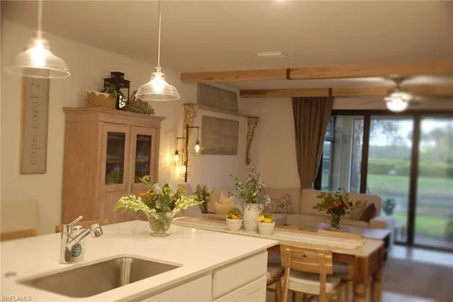 a kitchen with stainless steel appliances granite countertop a sink stove and microwave