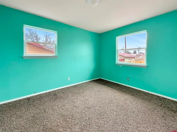 a view of a room with a window and a projector