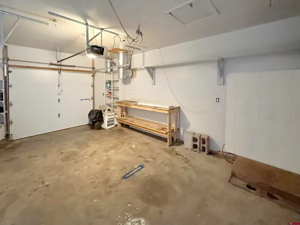 a view of a room with racks and air conditioner duct