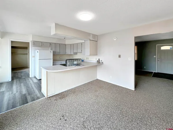 a view of kitchen with wooden floor