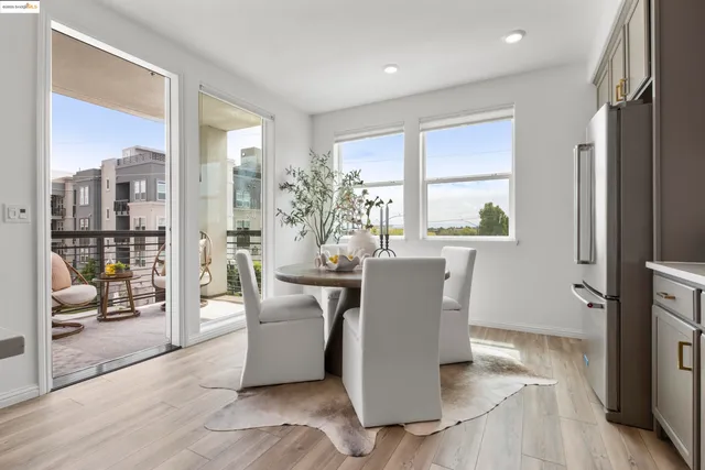 a kitchen with stainless steel appliances kitchen island granite countertop a sink and cabinets