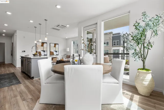 a kitchen with refrigerator and cabinets