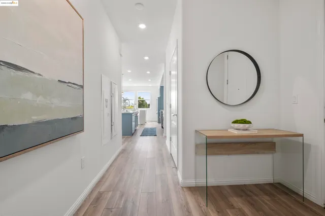 a balcony with furniture and a floor to ceiling window