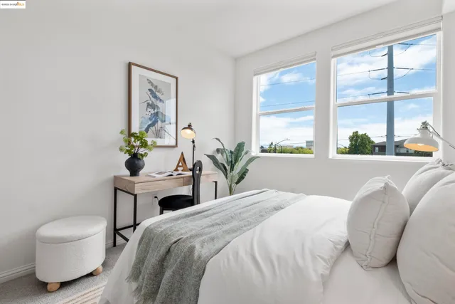 a bedroom with a bed and a table