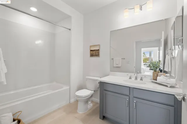 a bedroom with furniture and a potted plant