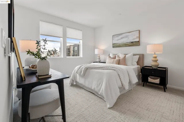 a bedroom with bed and a window