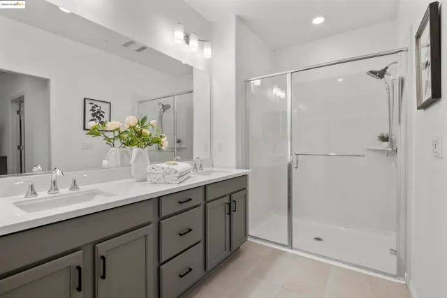 a bedroom with a bed and a lamp