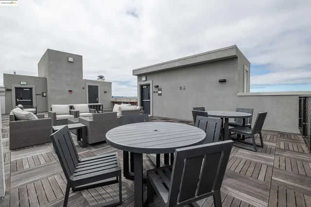 a terrace view with seating space barbeque oven and city view