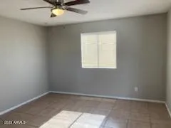 a white refrigerator freezer and a stove sitting inside of a kitchen