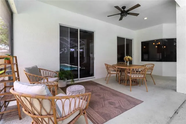 a dining room with furniture and window