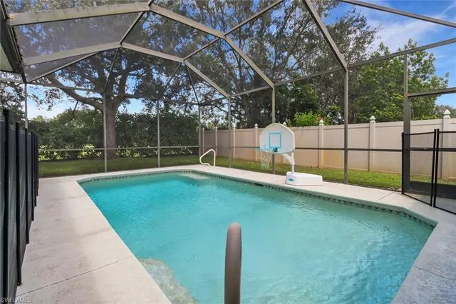 a view of a backyard with a small pool