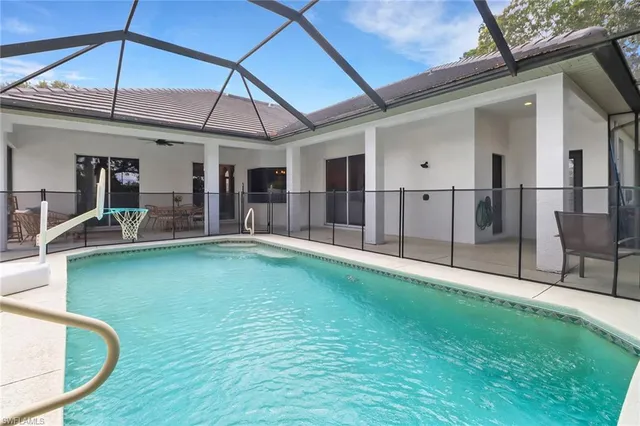 a view of a porch with furniture and floor to ceiling window