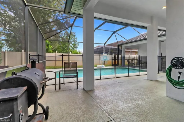 a view of a chair and table on the garden