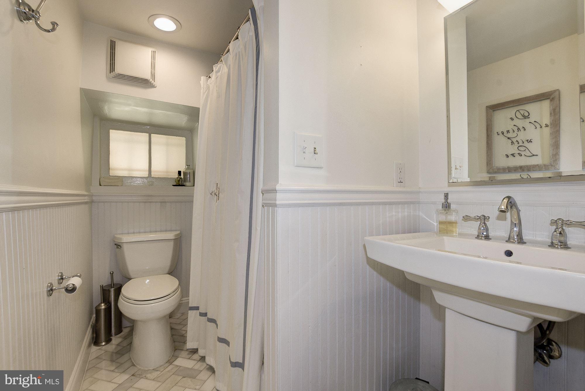 2011 Kalorama Road Northwest, Unit 1 Washington, DC 20009 - Photo 11 of 15 White modern bathroom is updated and clean!