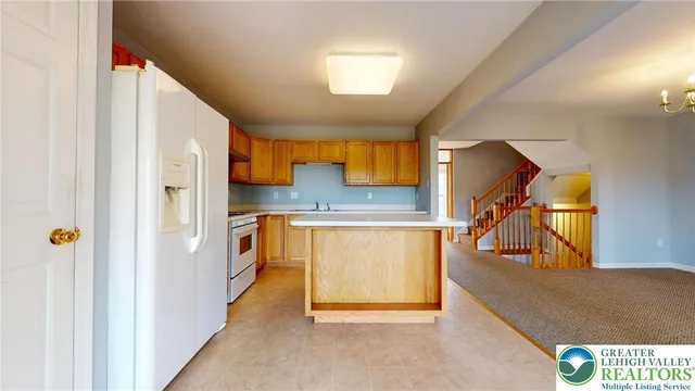 a view of a kitchen from the hallway
