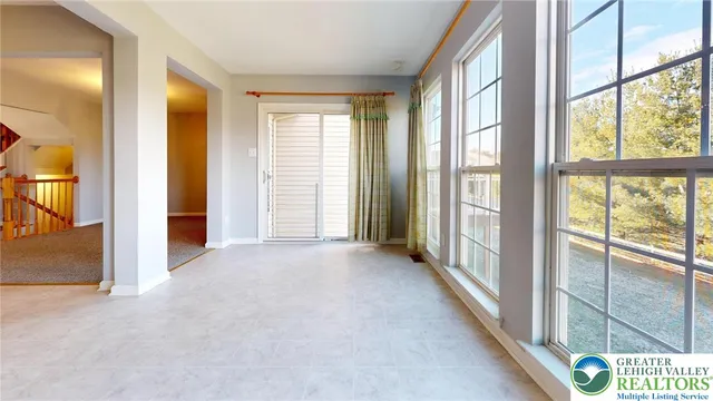 a view of a room with windows