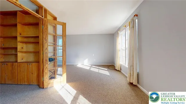 a view of entry way with wooden walls
