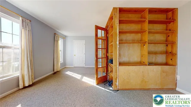 an empty room with windows