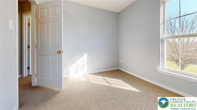 a white toilet sitting next to a bath tub