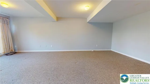 an empty room with a bench